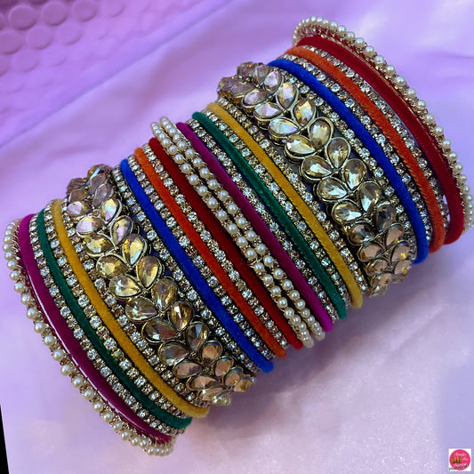 Multicoloured Kundan Pearl Zirconia Velvet Metal Bangles Set